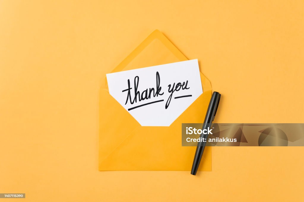 Thank You Message and Yellow Envelope Opened envelope with thank you message Thank You - Phrase Stock Photo