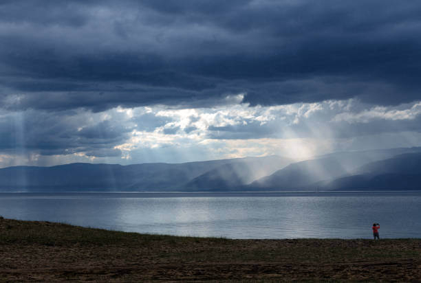 Sun beams  above Baikal it on Olkhon island and distant capes