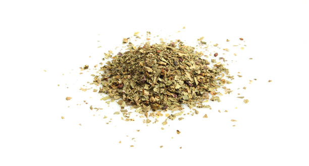 istock Pile of dry basil isolated on white background 1407118646