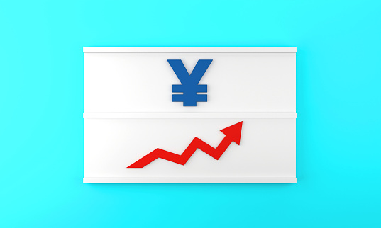 The Yen Sign and the arrow pointing up are on the lightbox. Finance and economy concept.