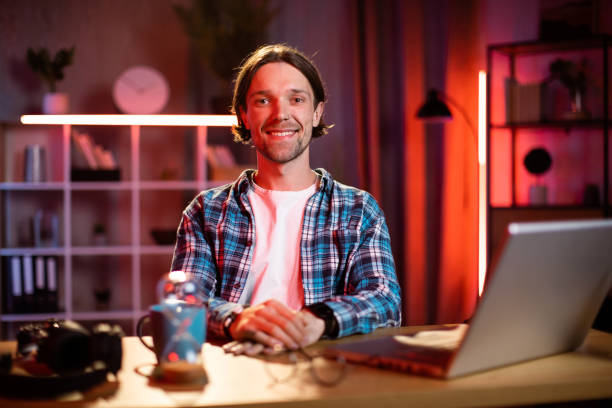 istock Distance work and learning. Young Caucasian guy student hipster with laptop for video conversation 1407121250