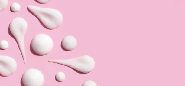 istock pattern texture foam mousse foam cosmetic smear sample on pink background 1407122935