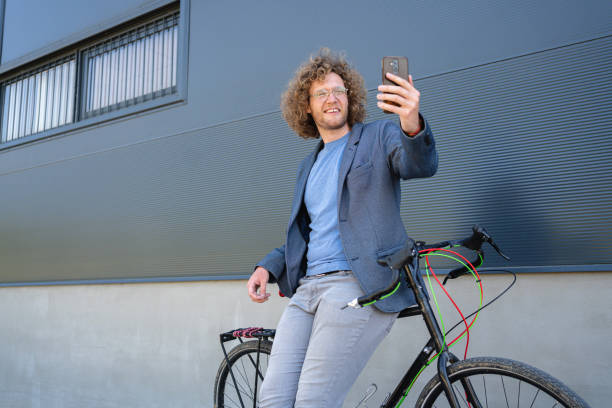 istock Businessman using phone and having a video call outside 1407126559
