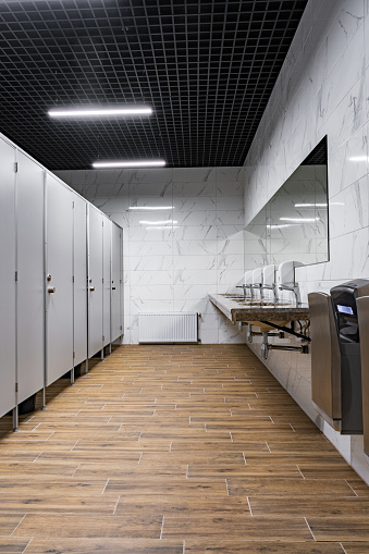 New public toilets partitioned into rooms and stone sinks