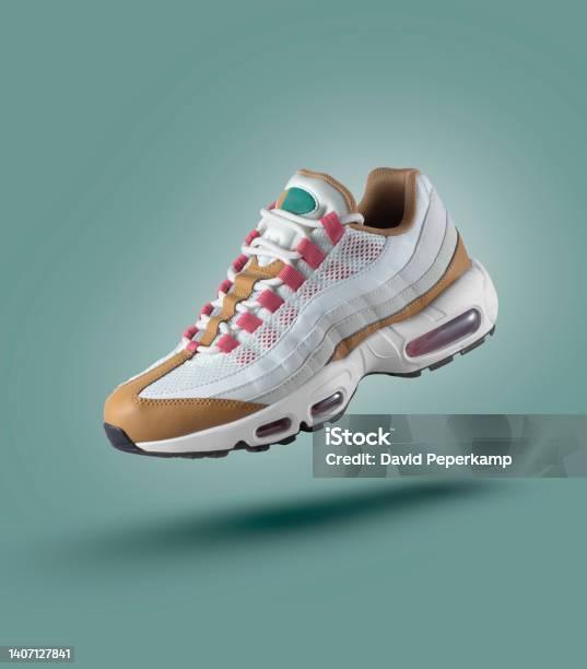 White Sneaker With Colored Accents On A Green Gradient Background Mens Fashion Sport Shoe Air Sneakers Lifestyle Concept Product Photo Levitation Concept Street Wear Trainer Stock Photo - Download Image Now