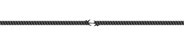 istock Rope torn in center. Black cable with pressure damaged fiber 1407127905