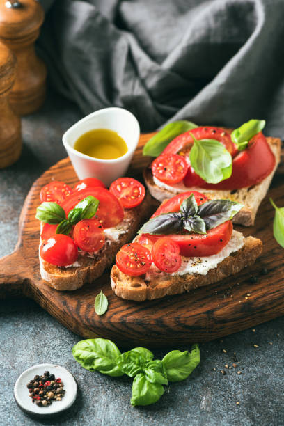 istock Italian tomato bruschetta with soft ricotta cheese 1407127960