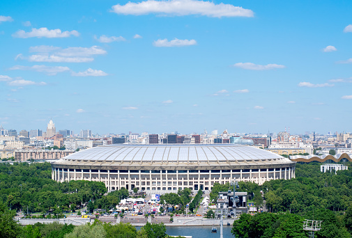 Moscow, Russia - June 24, 2022: Luzhniki stadium and the cityscape as seen from the Sparrow Hills on a sunny summer day