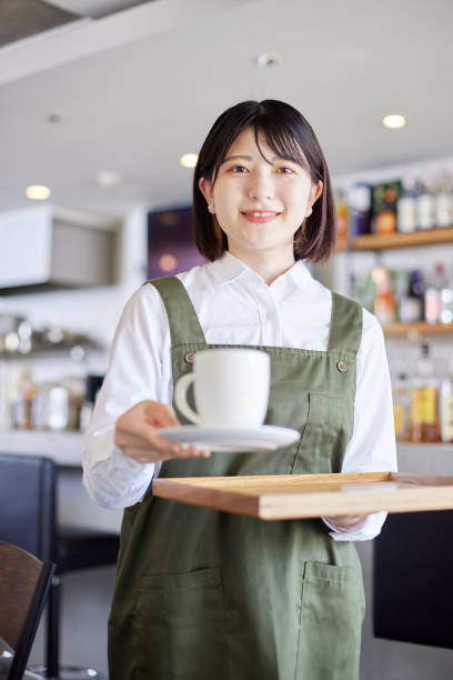 Young Japanese woman working at cafe