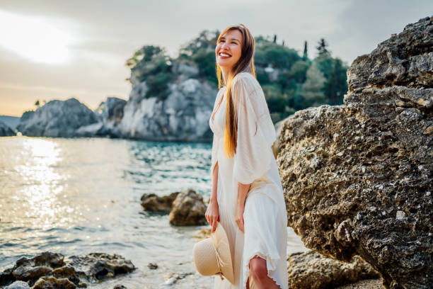 istock Woman enjoying the beach 1407131140