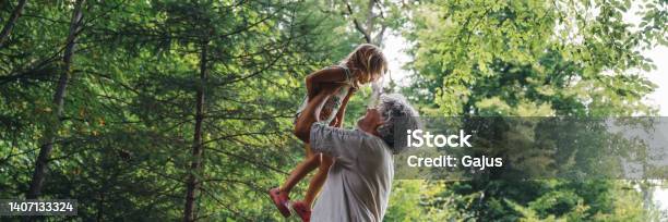 Wide View Image Of Beautiful Bond Between A Grandfather And A Granddaughter Stock Photo - Download Image Now