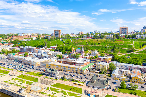 Aerial drone view of Nizhniy Novgorod city center with Volga embankment, Cathedral of the Blessed Virgin Mary Stroganoff church and Kremlin during sunny day, Russia.