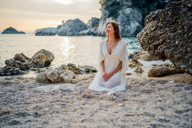 istock Beautiful woman on the beach 1407133967
