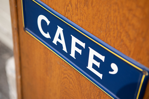 Cafe sign on a wooden background