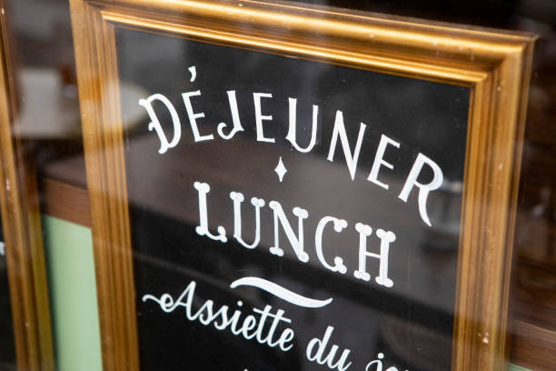 istock Decorative lettering in a frame in a French cafe window 1407136727