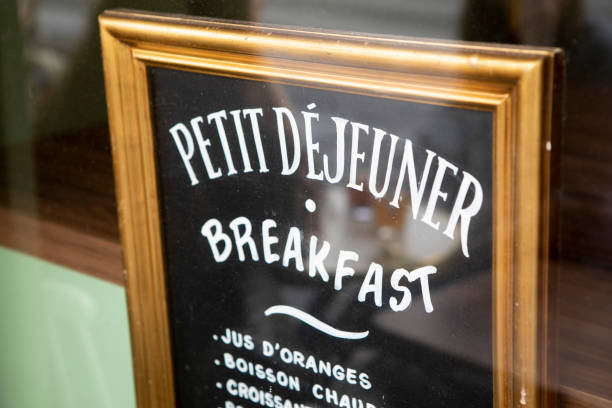 istock Decorative lettering in a frame in a French cafe window 1407136737