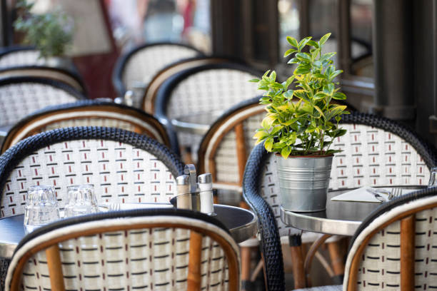 istock Tables and chairs on the pavement outside a cafe in Paris 1407136880