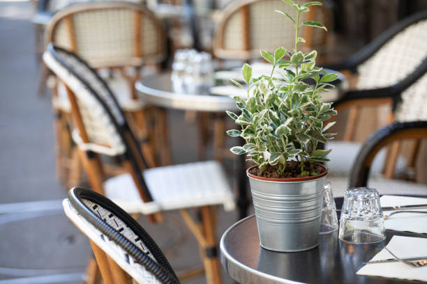 istock Tables and chairs on the pavement outside a cafe in Paris 1407136886