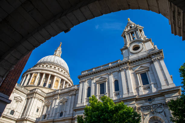 St. Pauls Cathedral in London, UK St. Pauls Cathedral, viewed from underneath Temple Bar in London, UK. paternoster square stock pictures, royalty-free photos & images
