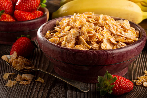 istock Corn flakes in the bowl with berries on the table. 1407140970