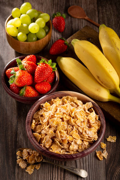 istock Corn flakes in the bowl with berries on the table. 1407140988