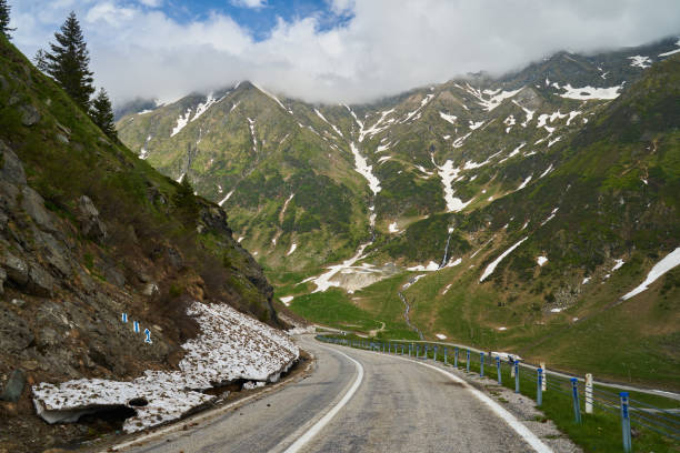 istock Winding road in the mountains 1407141034
