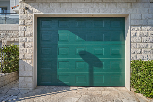 Modern gray garage door. Elegant automatic garage door.