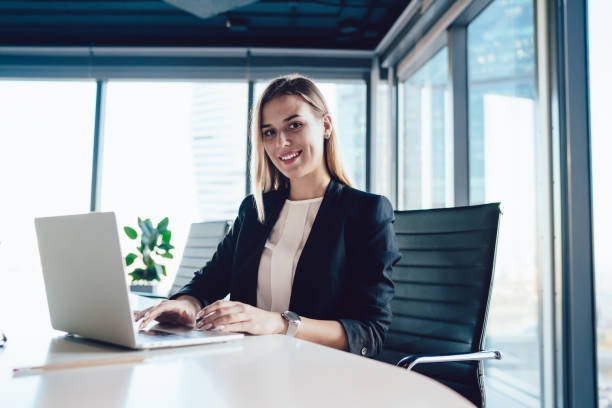 istock Smiling female executive manager typing on laptop in office 1407141128