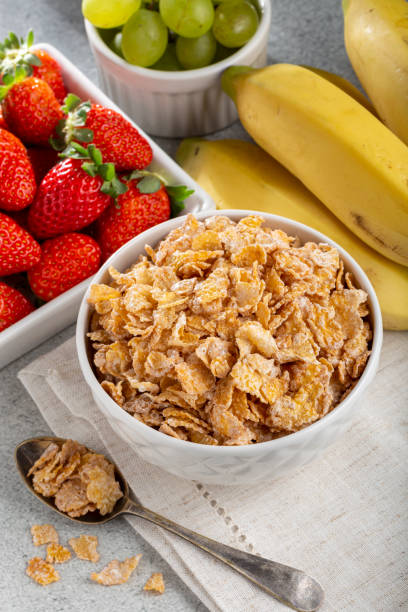 istock Corn flakes in the bowl with berries on the table. 1407141217
