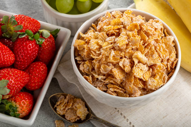 istock Corn flakes in the bowl with berries on the table. 1407141220