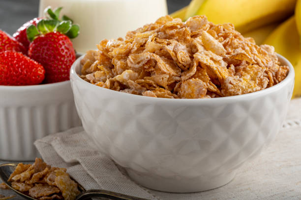 istock Corn flakes in the bowl with berries and milk on the table. 1407141244