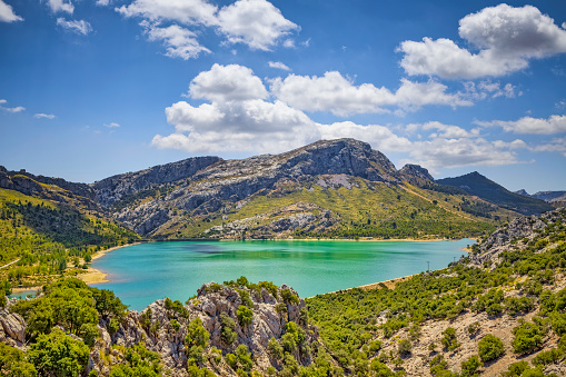 Cúber is an artificial water reservoir located at the valleys of Puig Major and Morro de Cúber, on the island of Majorca, Spain. With the Gorg Blau, they provide water to the city of Palma de Mallorca and the surrounding areas by the Almandrà torrent.