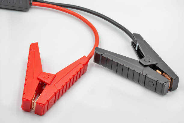istock Electrical connectors with clamps for car jump starter closeup 1407143107