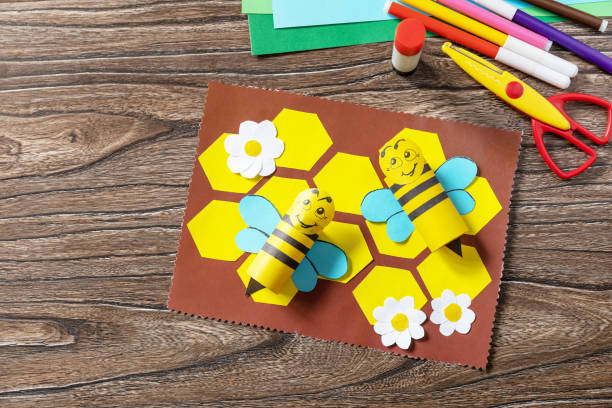 istock Summer card with voluminous bees. Handmade. Childrens creativity project, crafts for kids. 1407143809