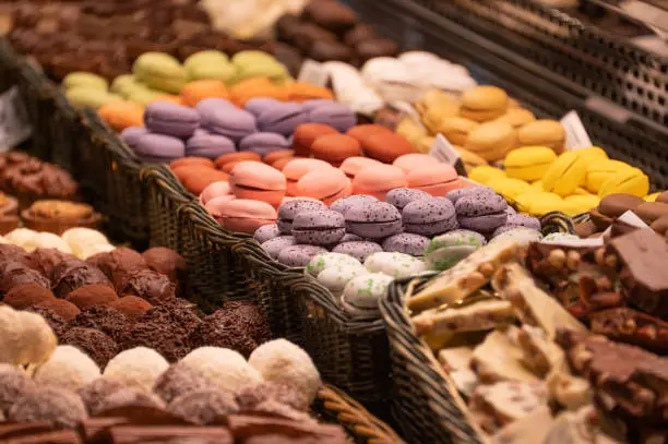 Photo of Different macarons in a market