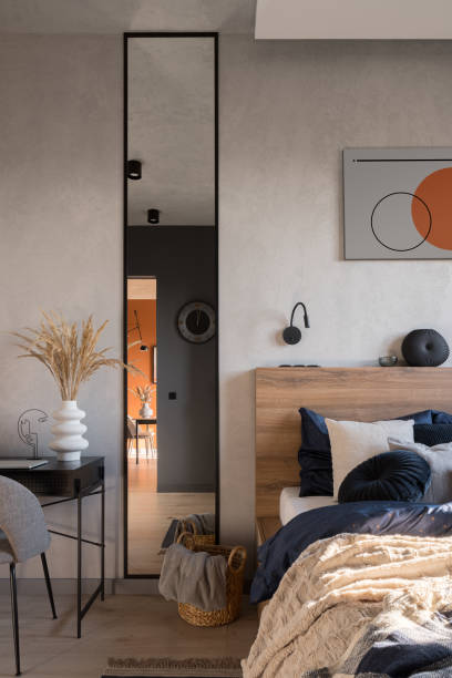 istock Narrow and tall mirror next to bed 1407145977