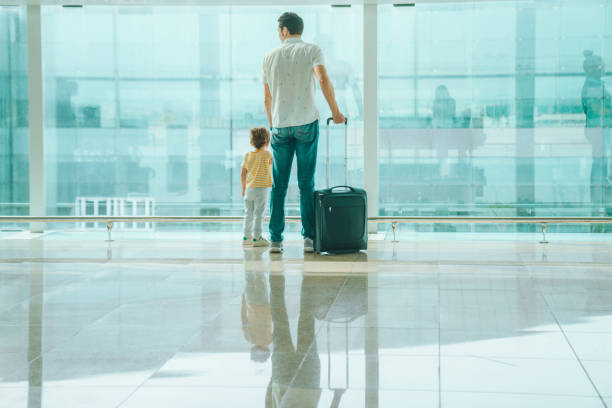 istock Father with his son at the airport 1407146187