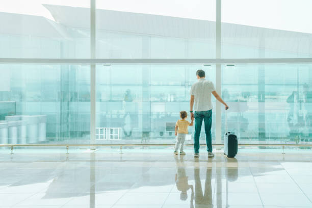 istock Father with his son at the airport 1407146189