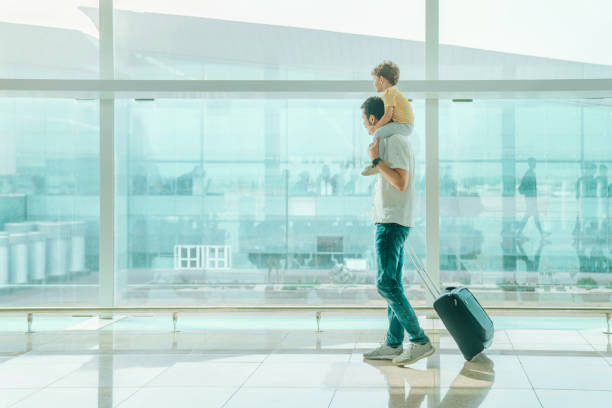 istock Father with his son at the airport 1407146217