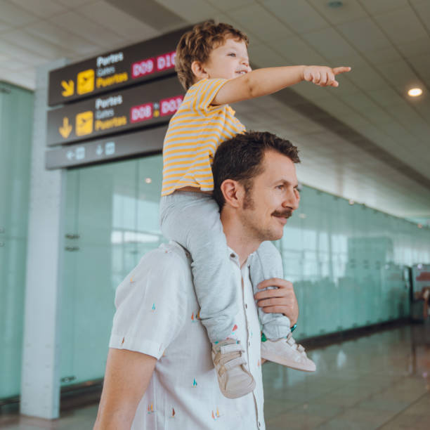 istock Father with his son at the airport 1407146218