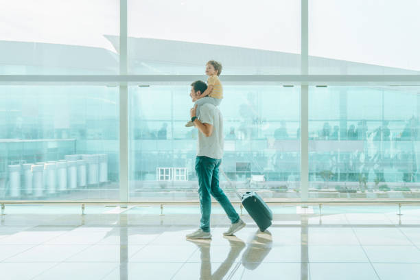 istock Father with his son at the airport 1407146222