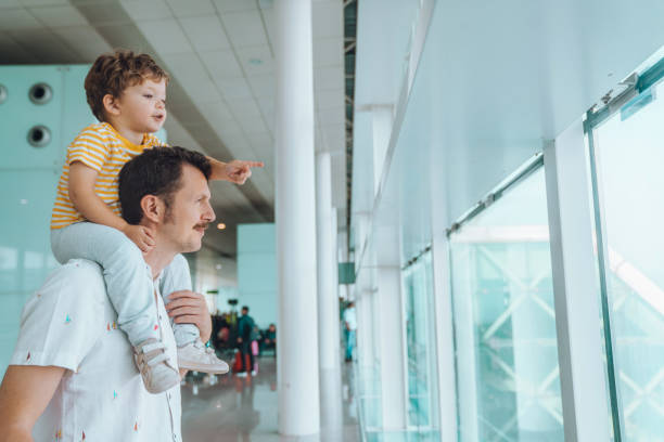 istock Father with his son at the airport 1407146224