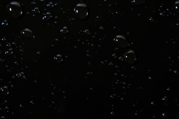 istock Abstract water drops on black background, macro, Bubbles close up 1407147522