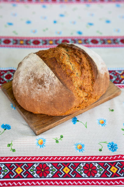 istock Palyanitsa bread and tablecloth in folk Ukrainian patterns 1407149356