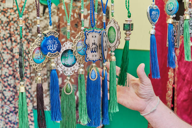 istock Muslim colorful amulets with Arabic script, hanging for sale. 1407151854