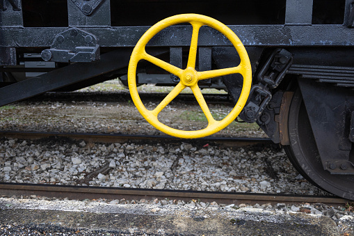 Yellow train iron handler. Old steam train in Martel, Dordogne, France