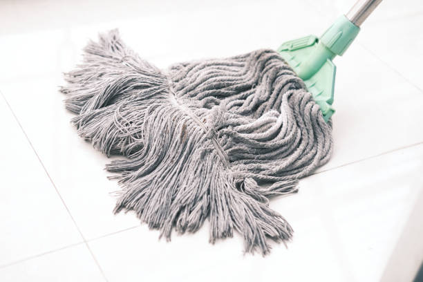 istock cleaning tiles floor with mop 1407152160