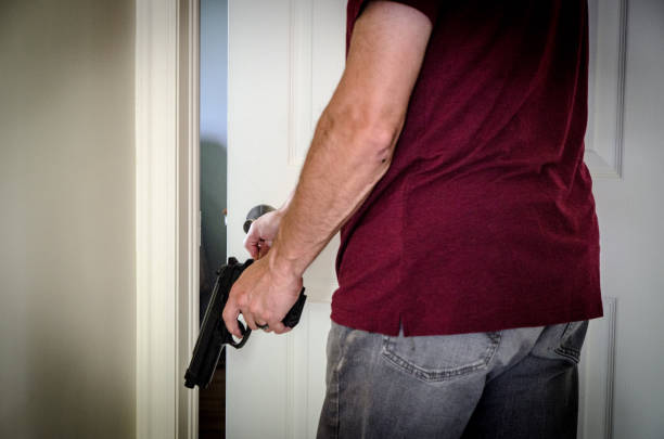 istock Armed man entering bedroom 1407152272
