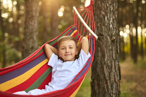 Mom and son relaxing in a hammock.