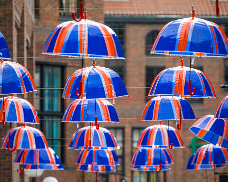 York, UK - June 6th 2022: Close-up of Union Flag umbrellas hanging in the city of York, UK, during the Queens Platinum Jubilee celebrations in 2022.